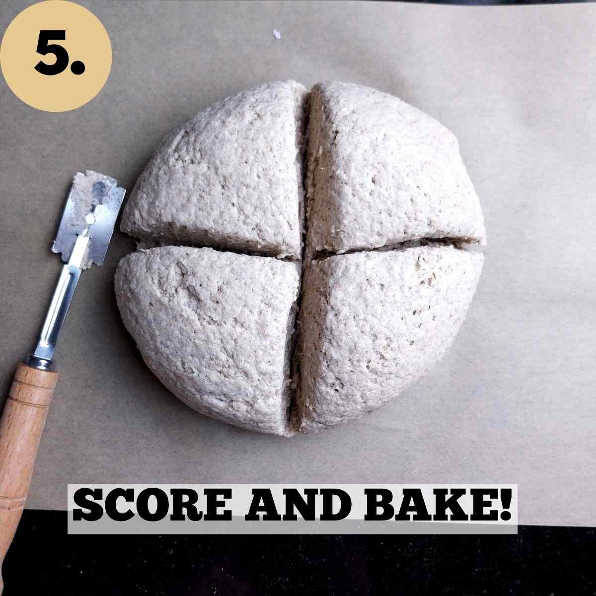 Scored dough on a piece of parchment paper on a baking sheet.