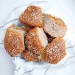 Buckwheat buns on a kitchen towel.