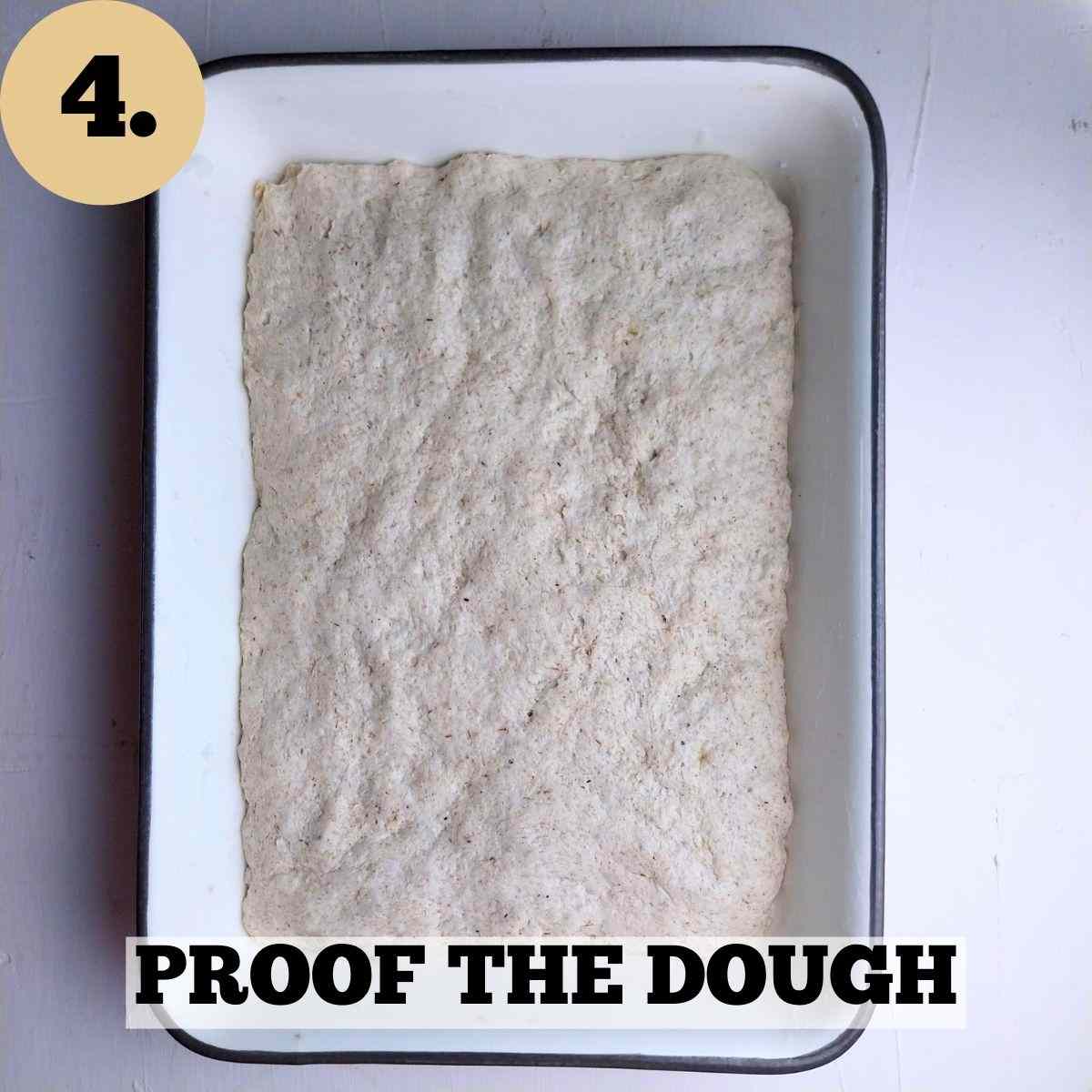 Focaccia dough in the baking dish.