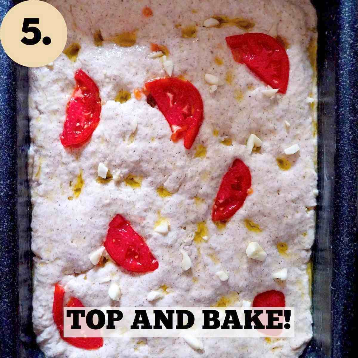 Focaccia dough with tomatoes in it.