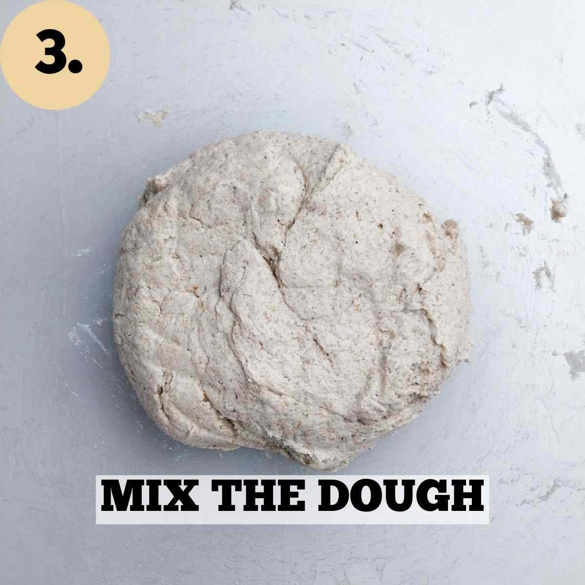 Dough in a glass mixing bowl.