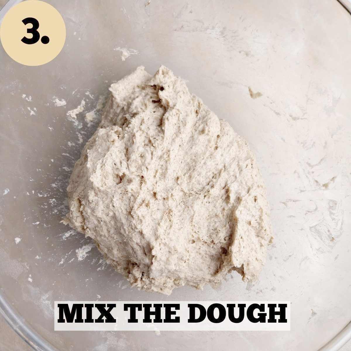 Mixed dough in a glass bowl.