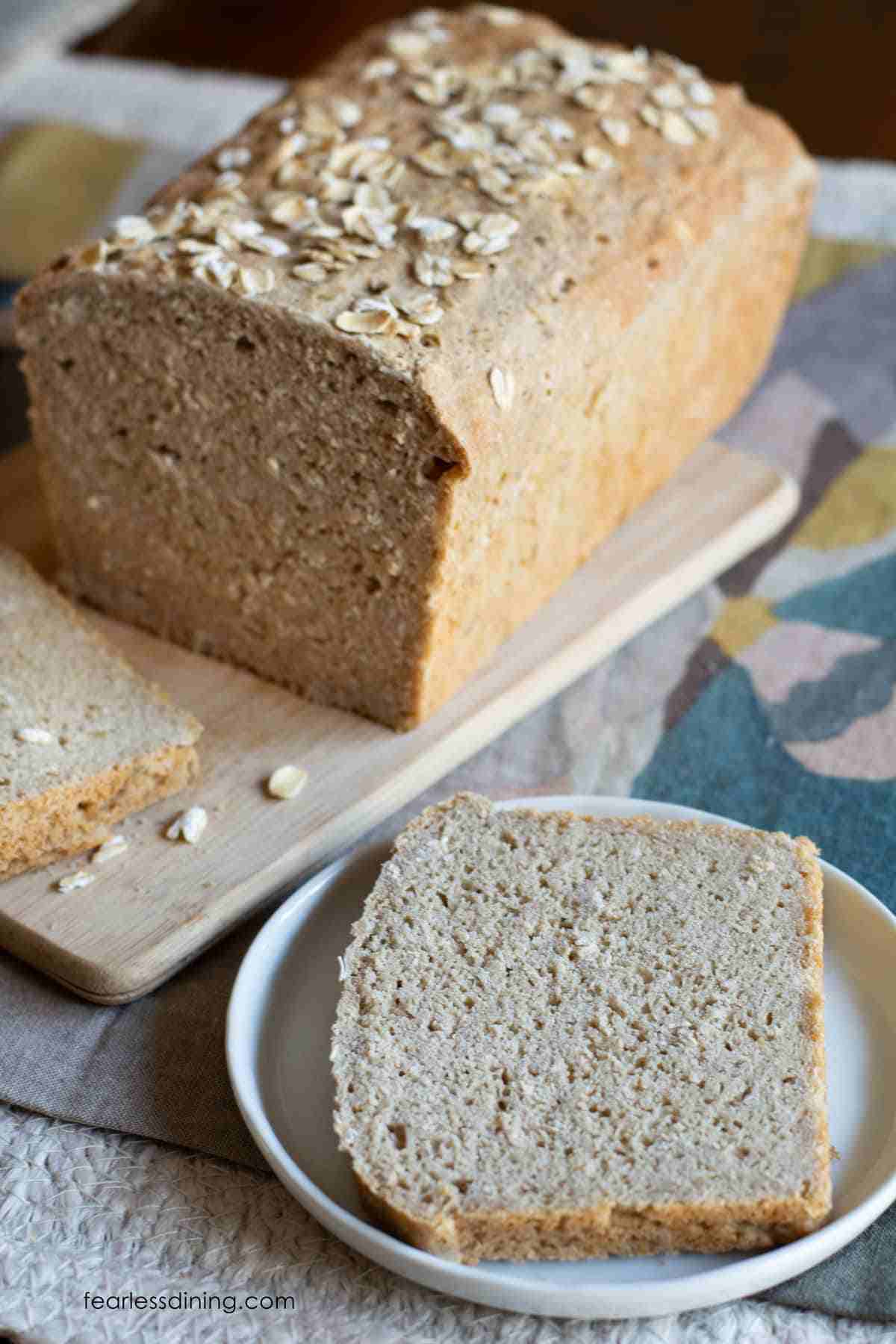 A sclice of oat bread on a plate.