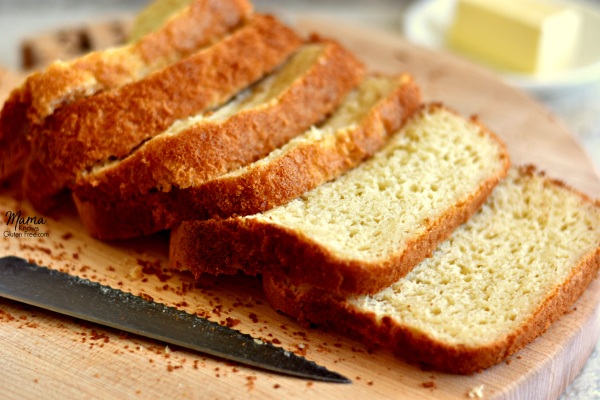 Sliced bread on a wooden board.