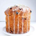 Gluten-free Easter bread on a white plate against a white background.