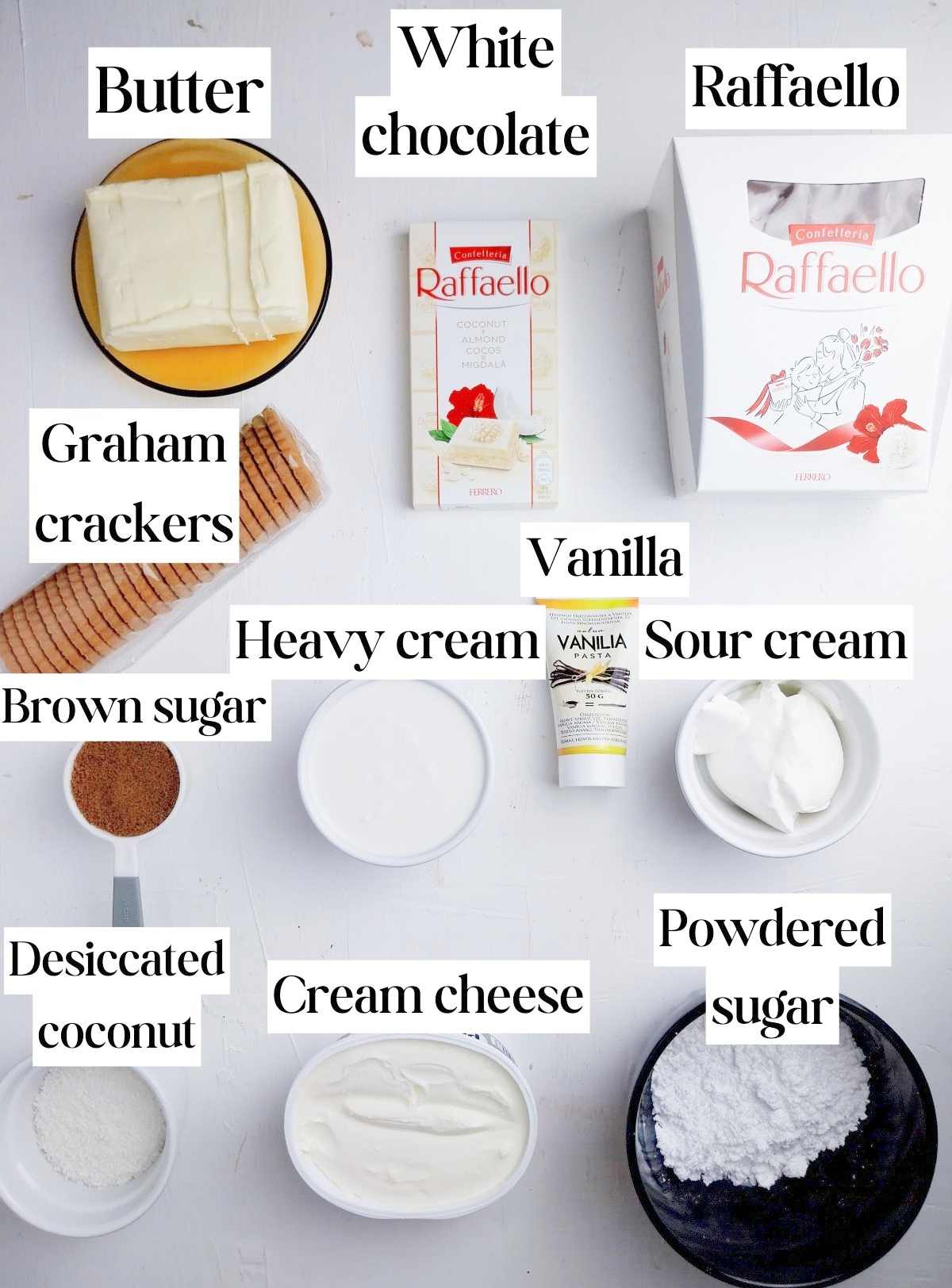 Ingredients for Raffaello Cheesecake on a white surface.