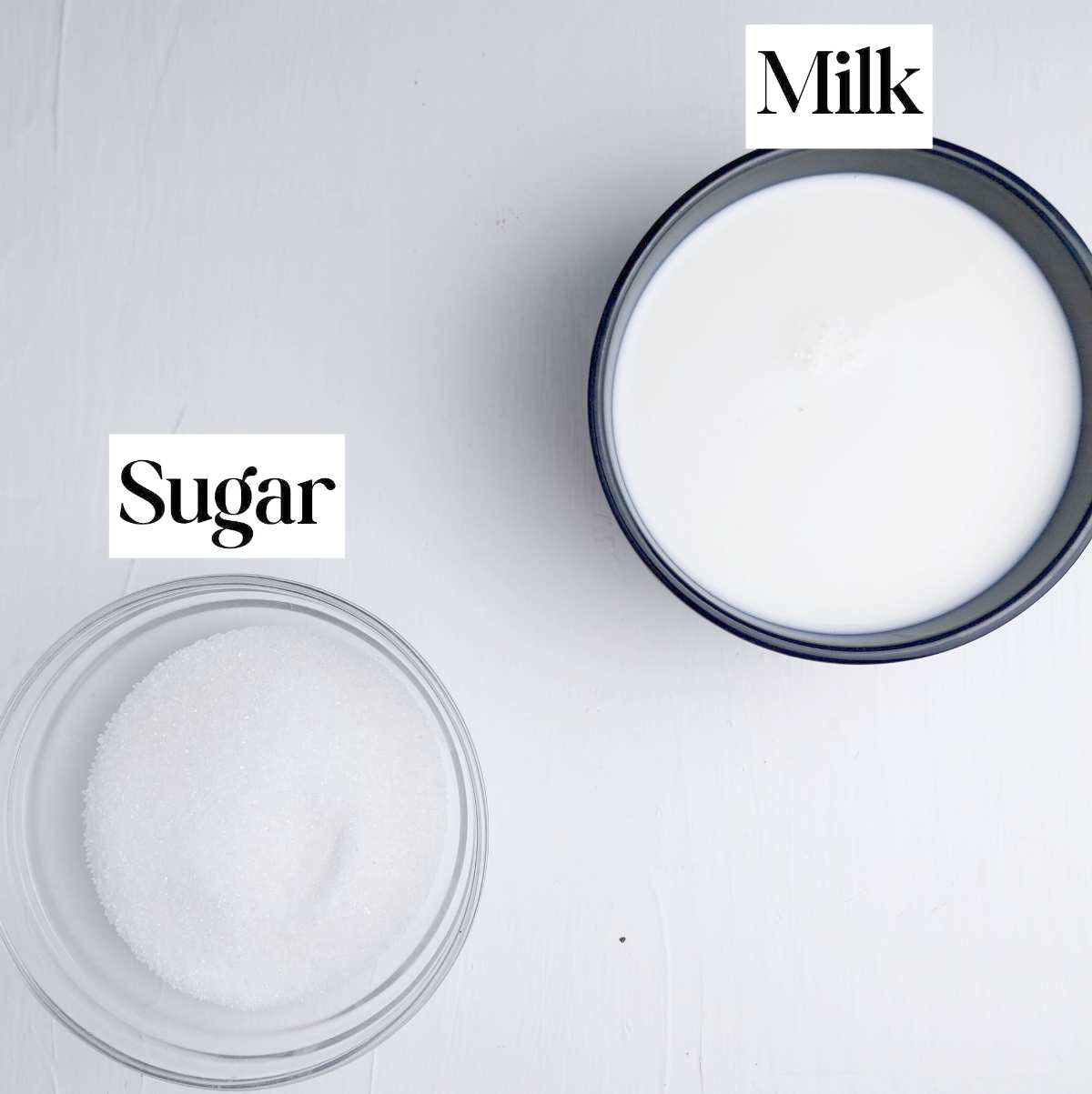 Two bowls on a white surface.
