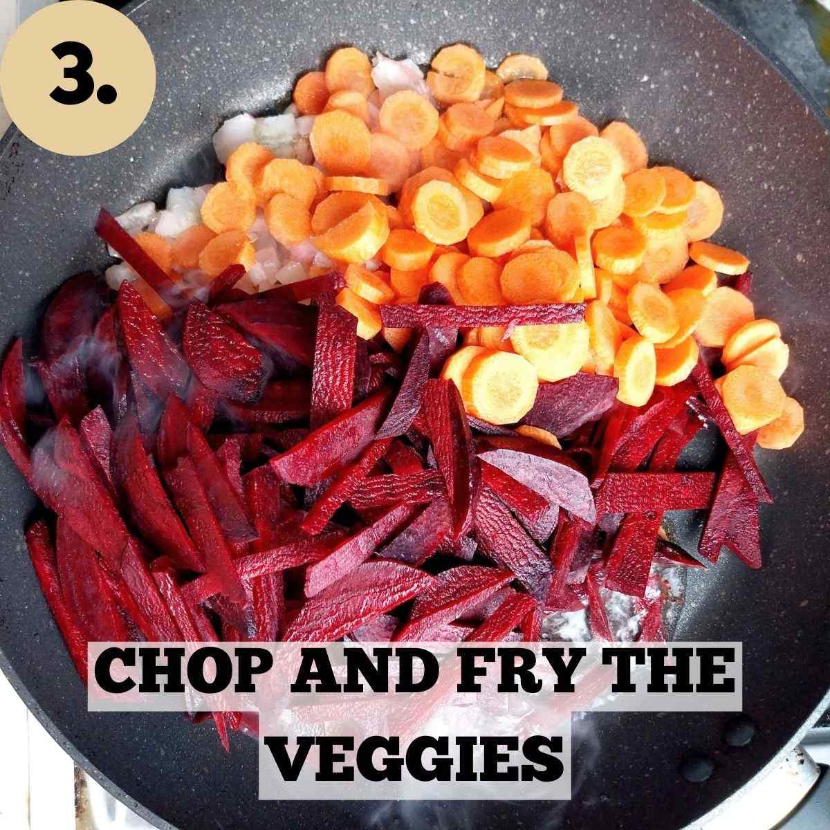 Chopped carrots, beets, and onion in a black frying pan.