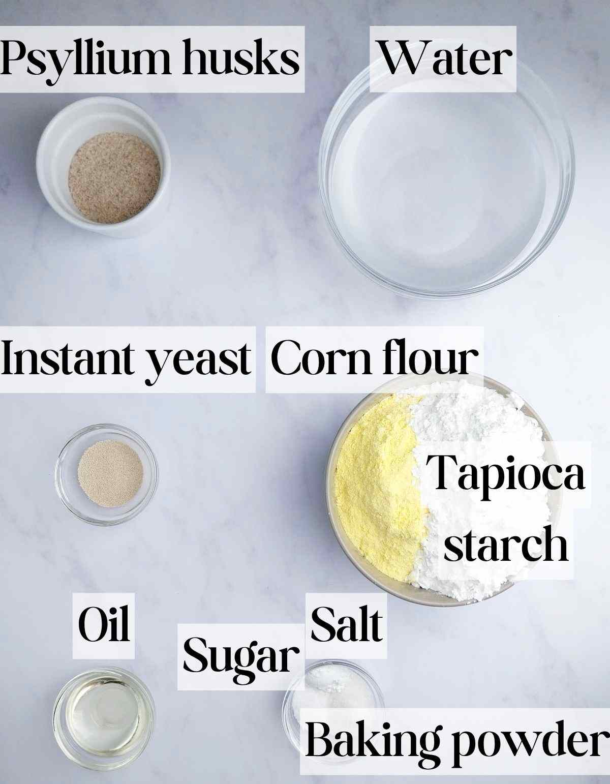 Ingredients for corn flour bread on a white background.