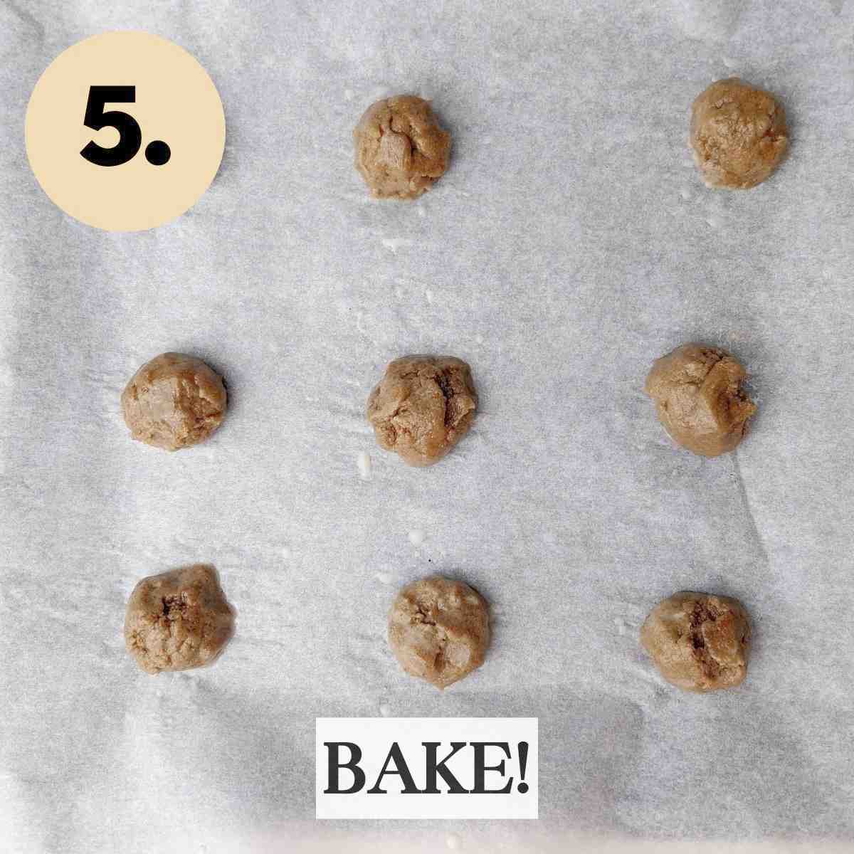 Finger milet cookie dough balls on white baking paper.
