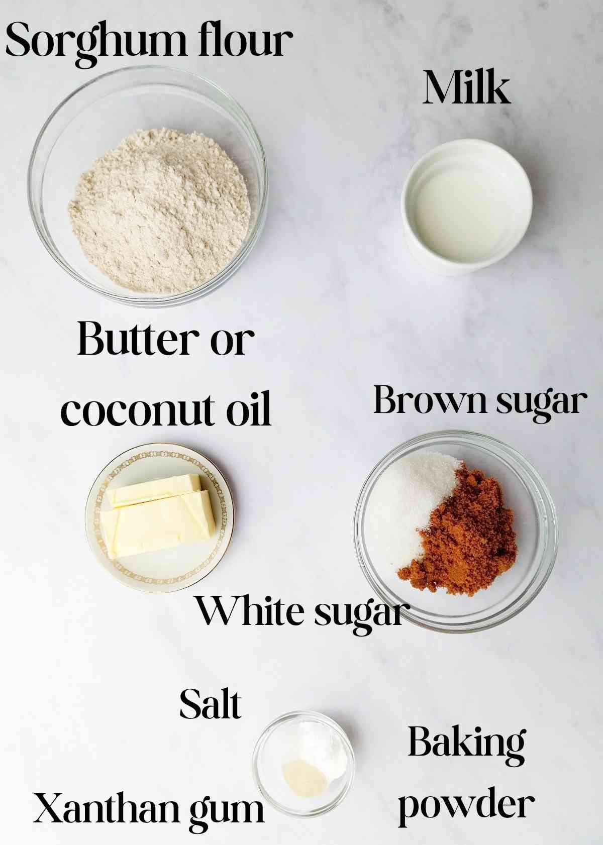 Ingredients for sorghum cookies on a white surface.